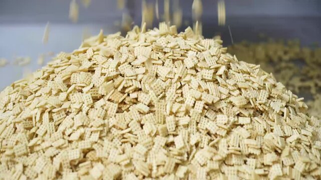Cookie food cake factory on an assembly line, automated Cookies on a Conveyor Belt Production Line in a Factory, ready for packaging and distribution.