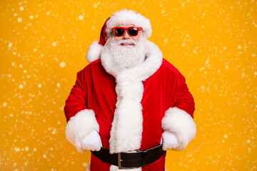 Portrait of his he nice attractive cheerful cheery Santa father ho-ho-ho festal mood newyear celebratory day isolated over bright vivid shine vibrant yellow color background