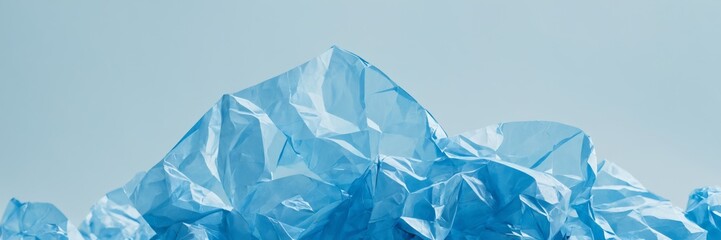 Obraz premium Textured background of a crumpled light blue plastic material