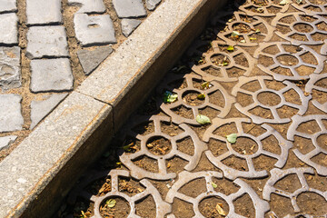 ancient 19th century pavement made of round cast iron blocks