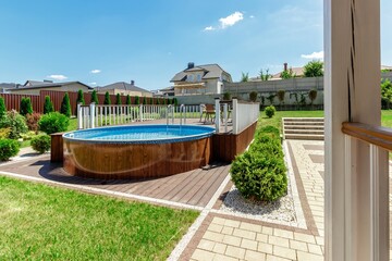 Cozy Backyard with Elevated Pool and Green Garden