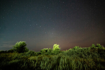 Fototapeta premium Shooting the night starry sky in the village of Burabay, a suburb of Shchuchinsk (Kokshetau), Kazakhstan. August, 2024