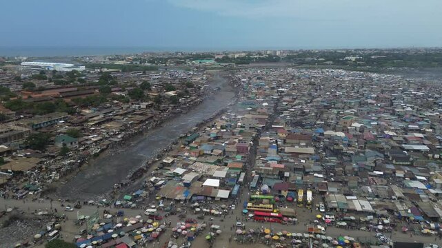 Ghana, Accra,   AGBOGBLOSHIE drone view Odaw River the largest landfill illegal dump in Africa for electronic and plastic waste from the Western world. mountain of toxic waste, environmental disaster 