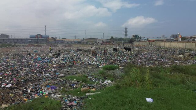 Ghana, Accra,   AGBOGBLOSHIE the largest landfill illegal dump in Africa for electronic and plastic waste. High environmental toxic pollution area , climate change warming ,men work in the landfill