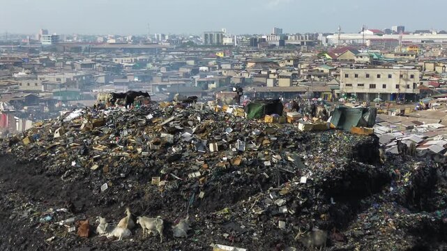 Ghana, Accra,   AGBOGBLOSHIE the largest landfill illegal dump in Africa for electronic and plastic waste from the Western world. High environmental toxic pollution area , climate change warming 