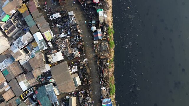 Ghana, Accra,   AGBOGBLOSHIE drone view Odaw River the largest landfill illegal dump in Africa for electronic and plastic waste from the Western world. mountain of toxic waste, environmental disaster 