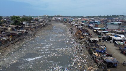 People live in slums immersed  immersed in toxic waste that poisons the land and river waters in...