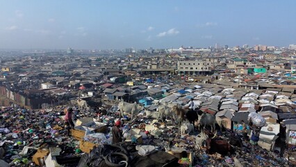 Ghana, Accra,   AGBOGBLOSHIE drone view Odaw River the largest landfill illegal dump in Africa for electronic and plastic waste from the Western world. mountain of toxic waste, environmental disaster 