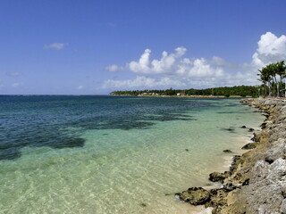 Sainte Anne coastline close to city center in guadeloupe with scenic turquoise sea and rocks...
