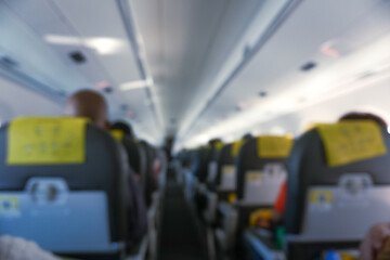 Blurry Image Of The Passenger Environment On The Seats Inside A Plane 