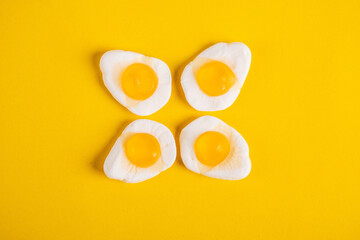 Egg jelly candy isolated on the yellow background