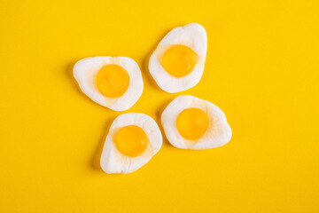 Egg jelly candy isolated on the yellow background