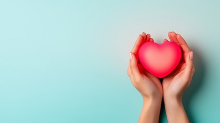 Obraz premium Hands gently cupping a small glowing heart, soft light against a pastel gradient background, symbolizing compassion and connection for World Kindness Day 