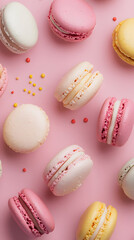 Obraz premium Colorful macarons on a soft pink backdrop, vibrant hues create an inviting and cheerful display, perfect for dessert lovers and events.