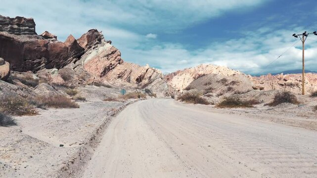 Drone advancing over the unpaved section of Route 40 in the northern Salta province, Quebrada de las Flechas, Argentina.