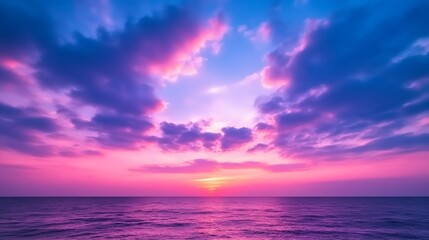 Obraz premium A glowing sunset sky painted in shades of purple and burgundy, with soft clouds reflecting the rich colors, creating a romantic and moody atmosphere 