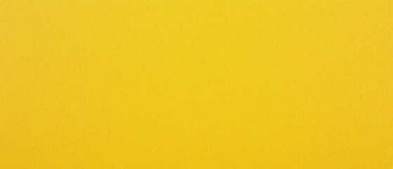 Obraz premium Bright yellow plain paper texture with a smooth finish