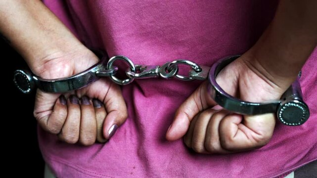 Woman hands in handcuffs
