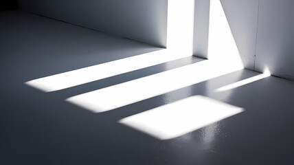 Soft shadows on a gray floor created by sunlight streaming through a corner, enhancing minimalistic interior design.