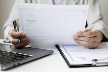 Business woman employer holding resume hiring recruit looking cv resume to hire candidates,...
