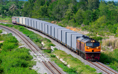 Obraz premium freight Container train num 777 at Prachuap Khiri Khan