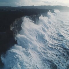 Aerial shot of massive waves crashing against cliffs during a typhoon, typhoon, power of nature