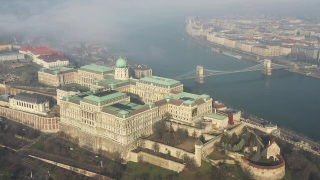 A view of Buda Castle from above on a foggy day