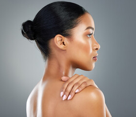 Shoulder, makeup or profile of woman with skincare in studio on grey background fo facial glow. Dermatology treatment, girl or face of confident model with cosmetics, beauty or transformation results