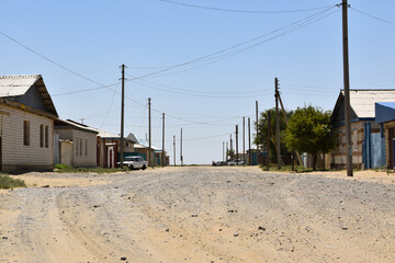 A dirt road through the town of Aral in Kazakhstan