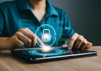 A person interacting with a digital tablet displaying security features in a modern office environment during the daytime