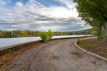 Vibrant Autumn Trees Turning Orange and Yellow by Max-Eyth Lake in Stuttgart