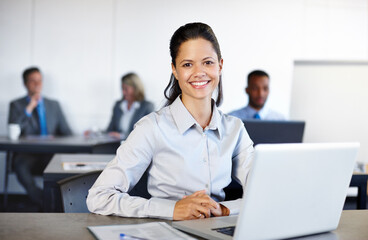 Fototapeta premium Business woman, portrait and laptop in office for research, communication and networking clients. Employee, happy and tech for project management, corporate development and sustainability integration