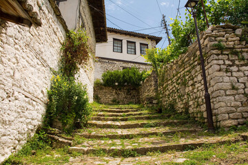 A narrow, cobblestone stepped street in the historic residential quarter of the castle district,...