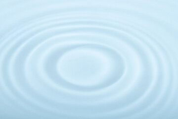 Water with circular ripples. Fluid motion, natural pattern.