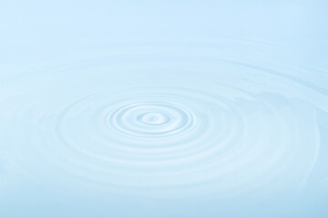 Water with circular ripples. Fluid motion, natural pattern.