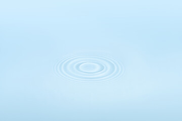 Water with circular ripples. Fluid motion, natural pattern.