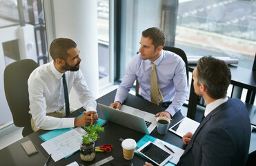 Meeting, finance or business people on laptop with group for feedback and discussion or teamwork. Corporate review, financial or professional colleagues talking for news, advice and planning online