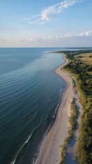 Tranquil shoreline view at sunrise along a serene coast in summer