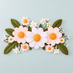 Obraz premium A colorful arrangement of felt flowers and leaves on a light blue background.