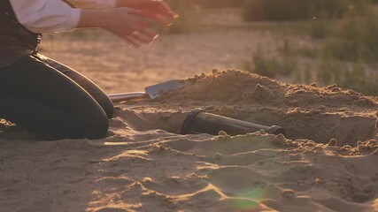 person body part close-up hands open treasure chest gold coins glowing shiny in sun light. Fantasy woman pirate finds treasure wooden box old style full of rich jewelry. Nature sand desert island 4k