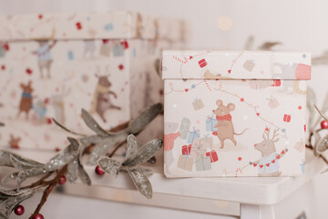 Christmas-themed gift boxes with cute illustrations of animals and presents, perfect for wrapping festive surprises.
