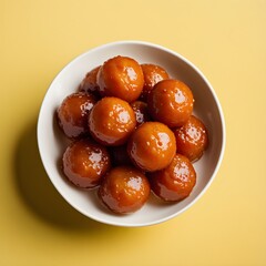 top view of sweet gulab jamun in a bowl