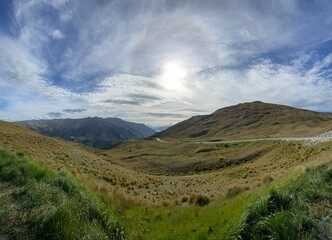 Scenic views at the Crown Range Summit Lookout . Landscape with mountains and clouds