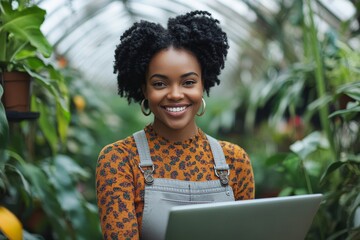 African american female gardener working on laptop in green house, standing by workplace surrounded by exotic plants and smiling at camera. Freelance, Generative AI