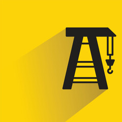 port crane icon with shadow on yellow background