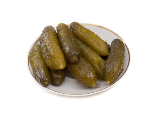 Pickled cucumbers in a plate on a white background.