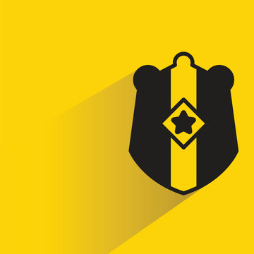 shield badge with shadow on yellow background