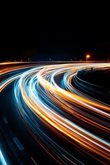 Captivating light trails from vehicles create a stunning visual effect on a winding roadway, capturing the essence of movement and speed at night.