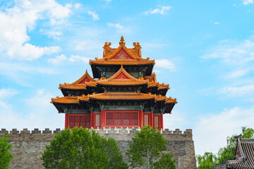 Watch Tower of Forbidden City under blue sky with white cloud at sunset in Beijing, China