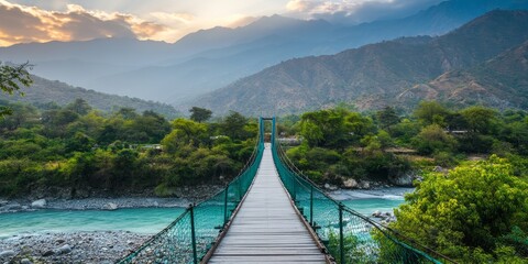 Aerial view of a modern suspension bridge spanning a wide river, the sleek design standing out against the natural landscape.